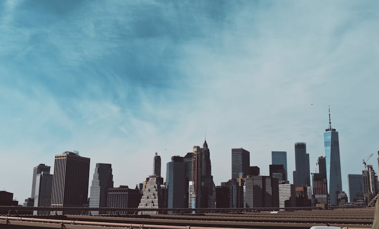 Stunning skyline view of New York City featuring iconic skyscrapers under a clear blue sky.