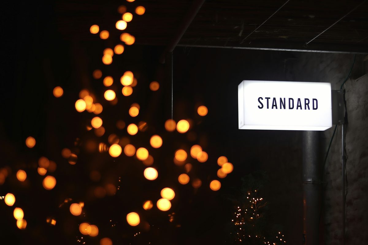 Illuminated sign reading the word STANDARD